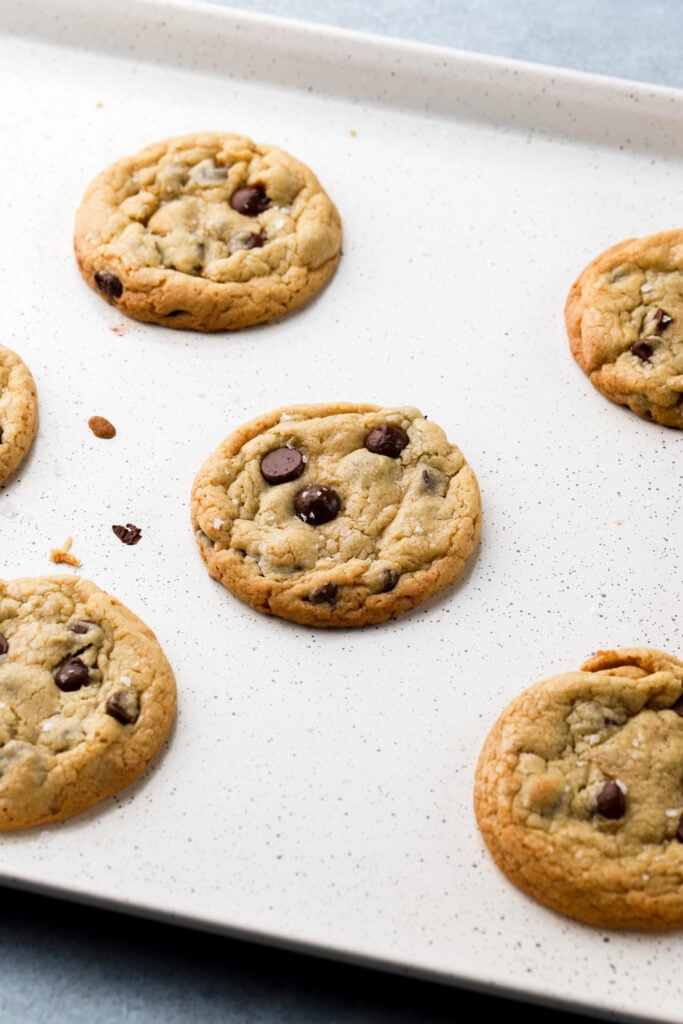 chocolate chip cookies fresh out the oven on baking sheet
