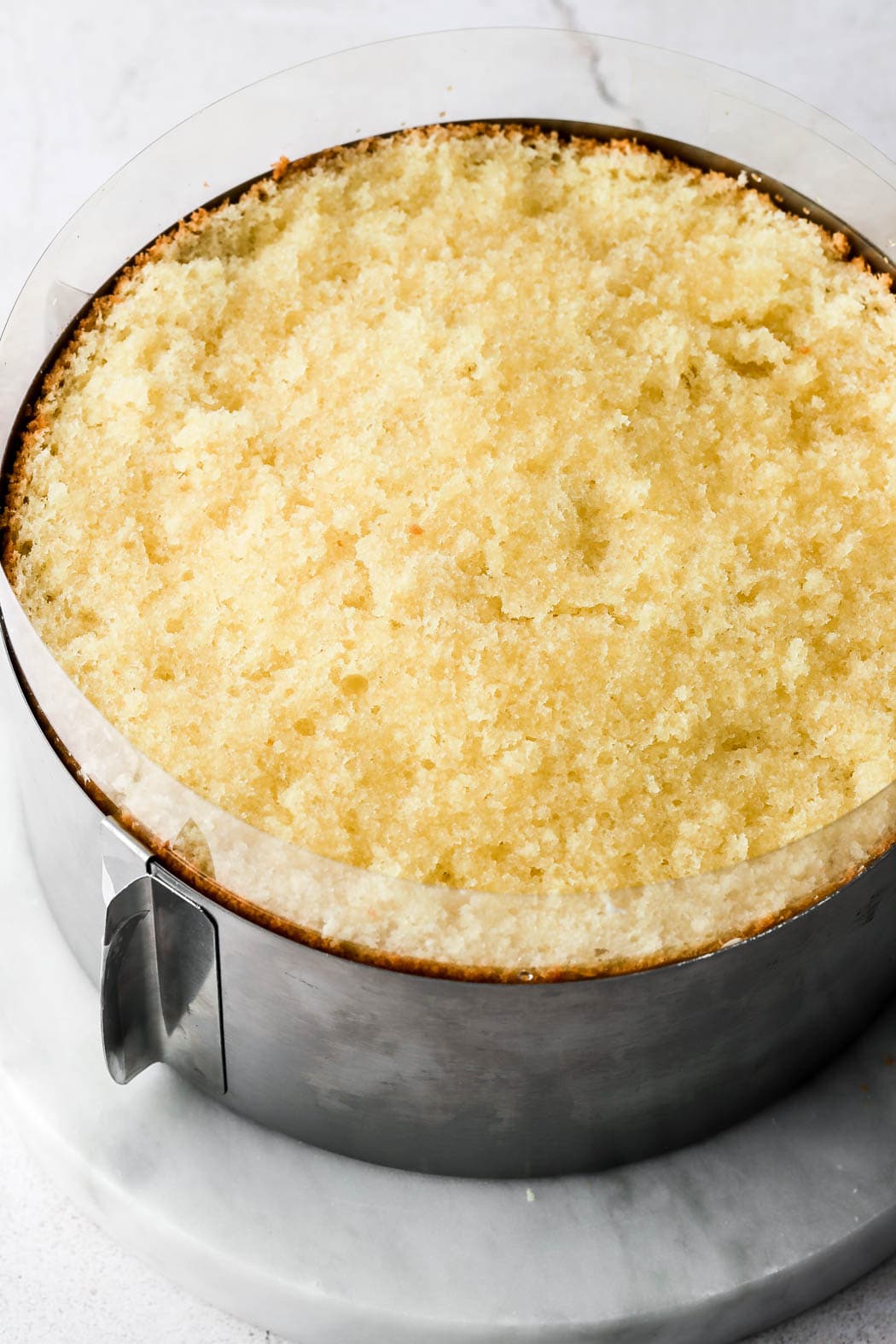 place second half of genoise on top and brush with simple syrup
