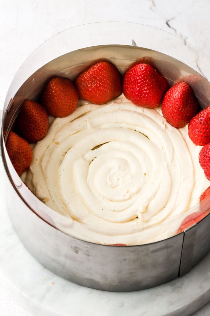 thin layer of crème mousseline and strawberry halves along the edge