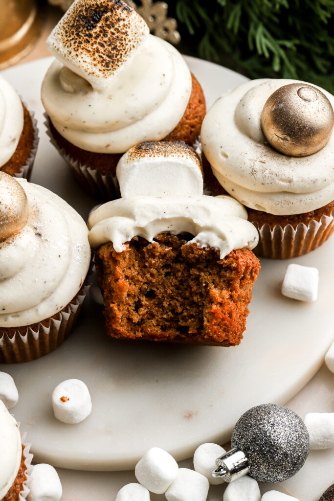 a bite taken out of a gingerbread cupcake