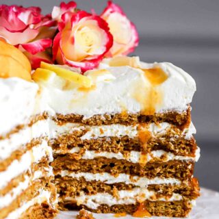honey lemon cake sliced into with aprict drip