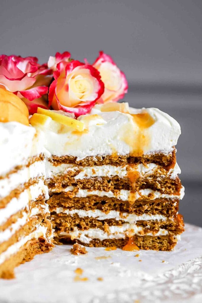 honey lemon cake sliced into with aprict drip
