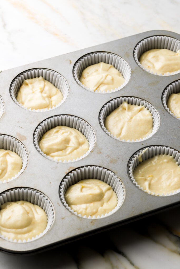 lemon cupcake batter in muffin tin