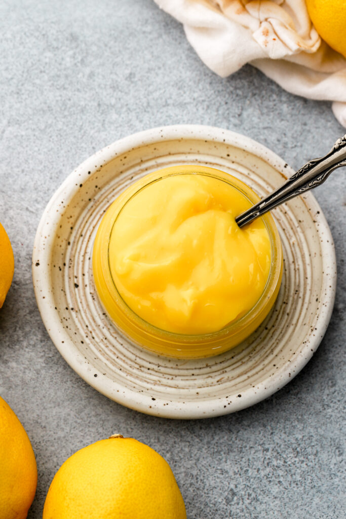 lemon curd surrounded by lemons