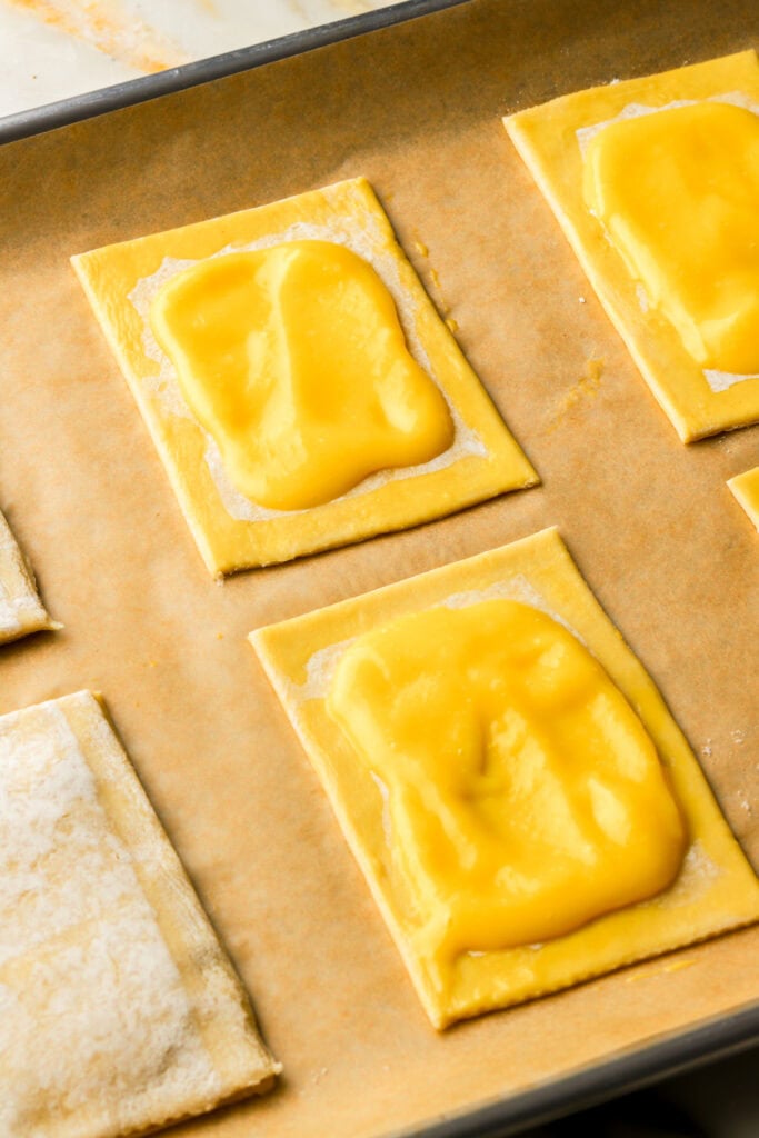lemon curd spread onto puff pastry and brushed with egg wash around the edge