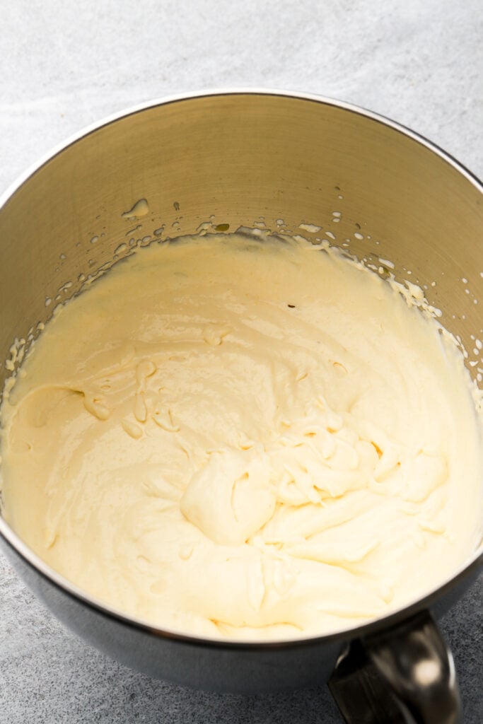 mango puree and sweetened condensed milk added to whipped cream