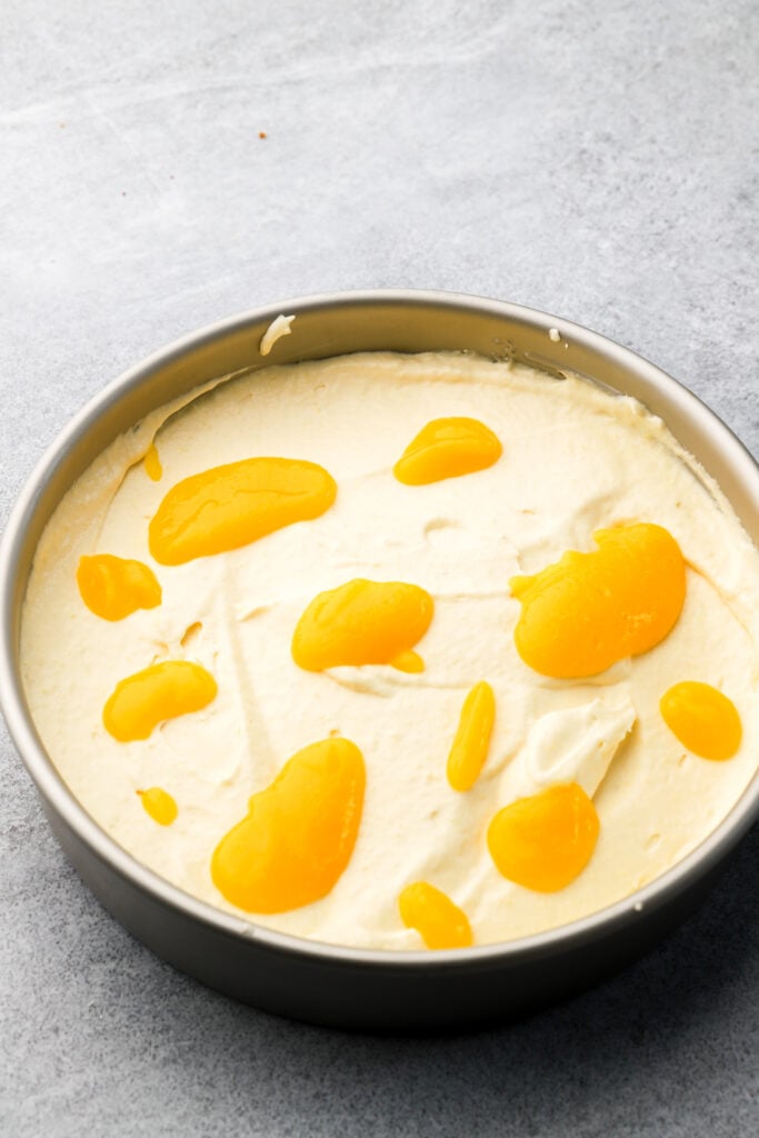 globs of mango puree on mango ice cream