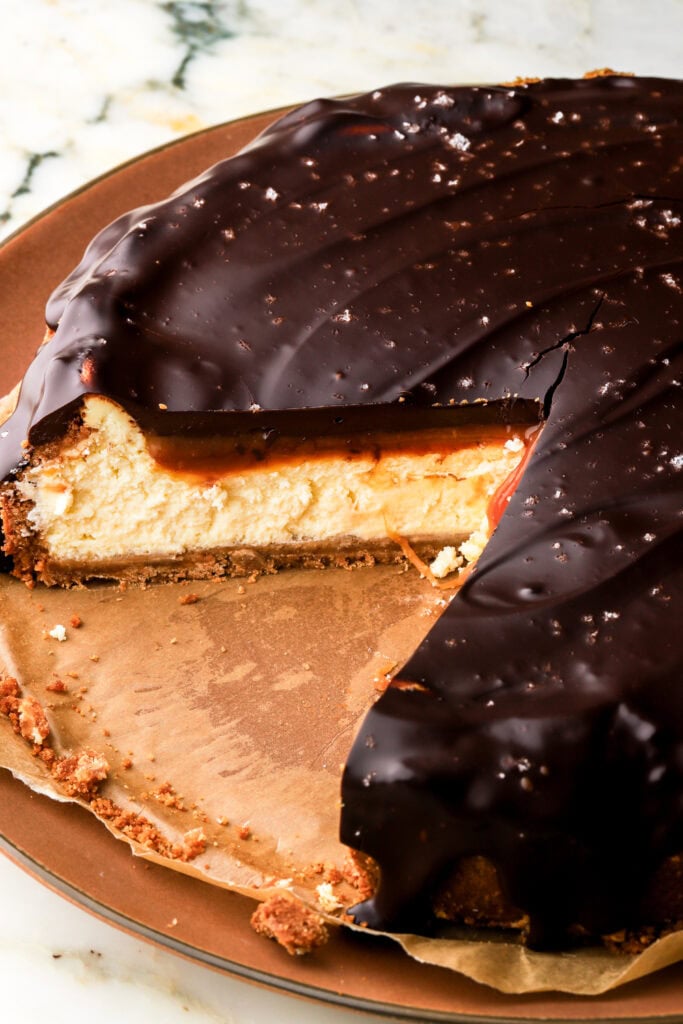 millionaire cheesecake with a couple slices removed