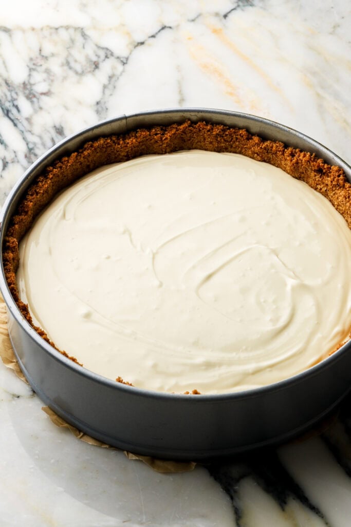 cheesecake batter poured over crust
