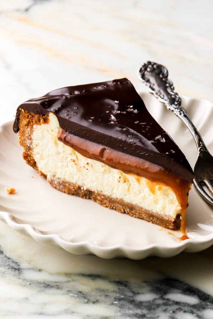slice of millionaire cheesecake on a plate