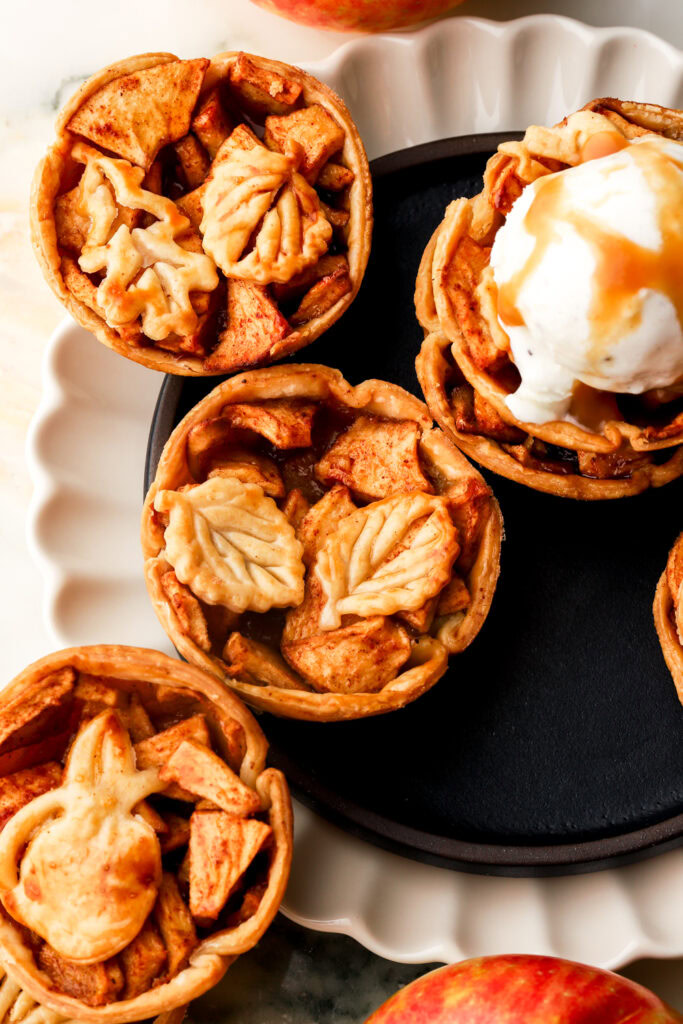 mini apple pies topped with cut out leaf designs