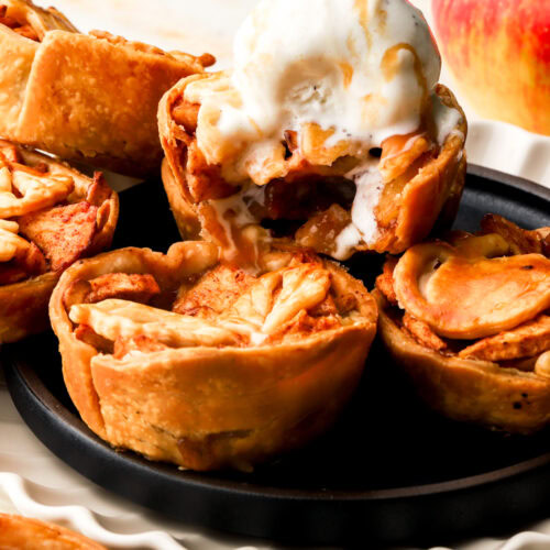 mini apple pies topped with vanilla ice cream