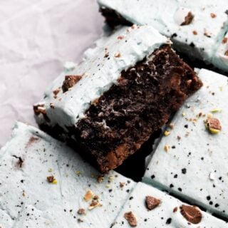 brownies stuffed with mini eggs and frosted with robins egg malted frosting