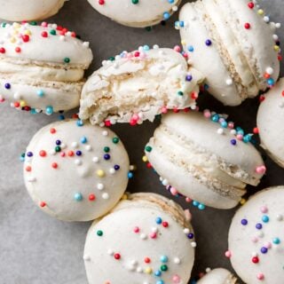 mini macarons with sprinkles and a bite taken out