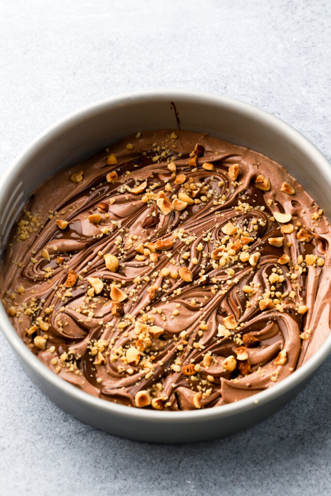 ice cream topped with hazelnuts and praline