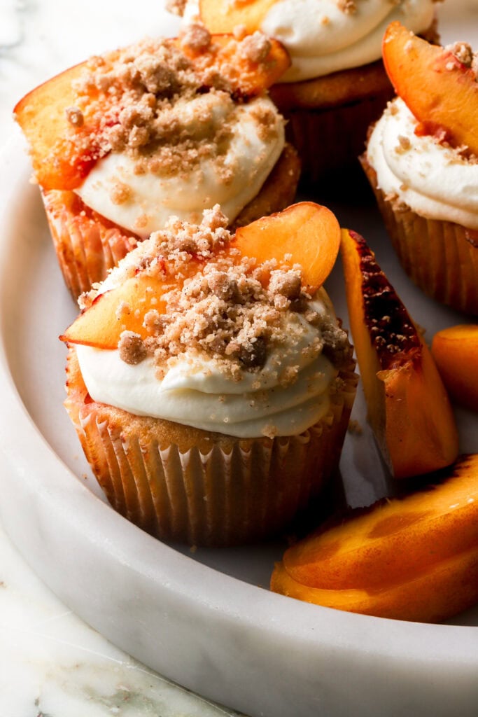 peach cobbler cupcakes in a marble tray