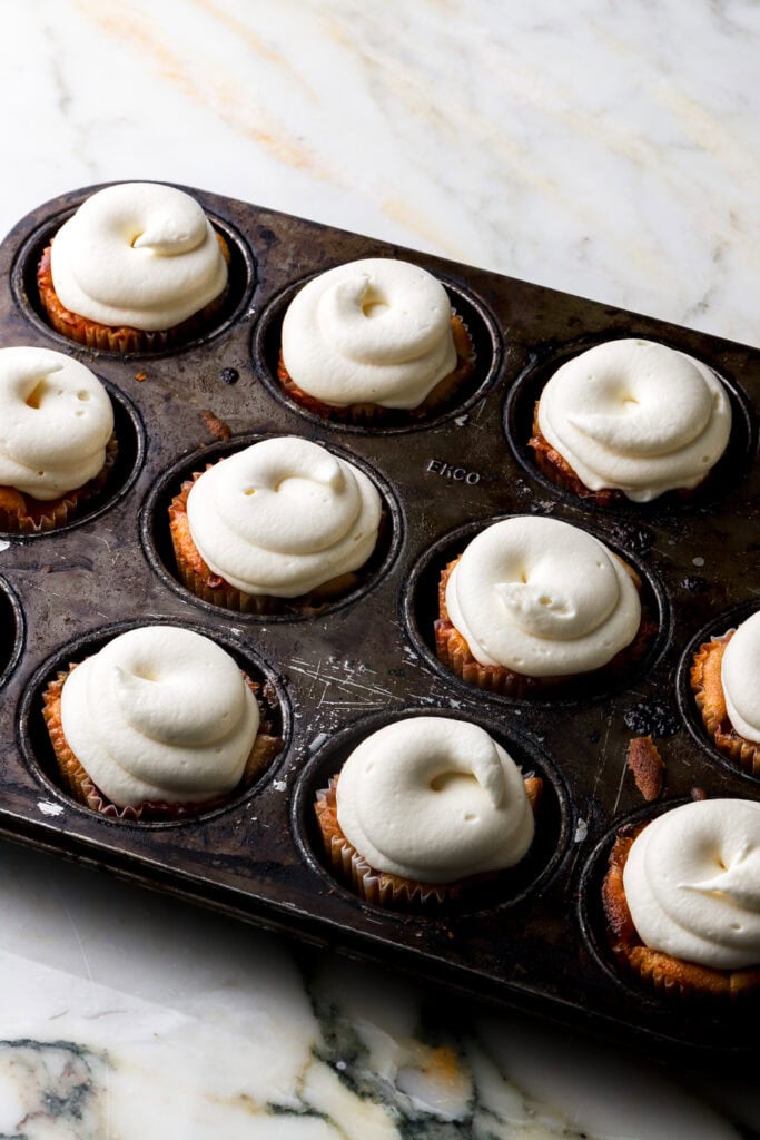 cupcakes topped with frosting