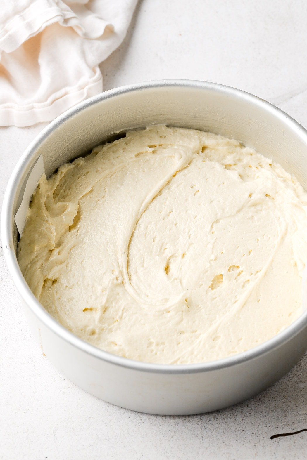 half of pound cake batter on top of peaches