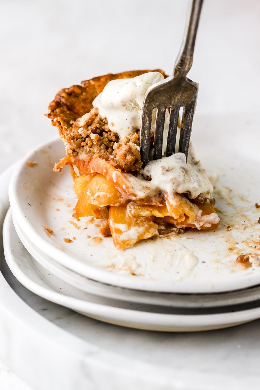 peach mango pie slice with ice cream