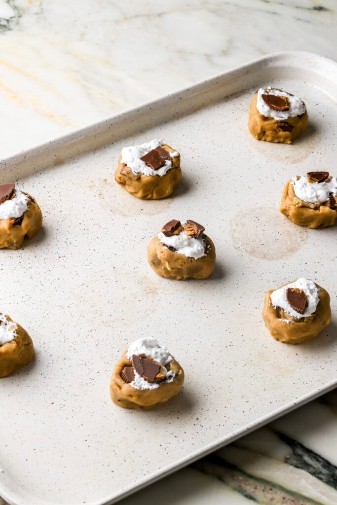 cookie dough balls topped with marshmallow fluff