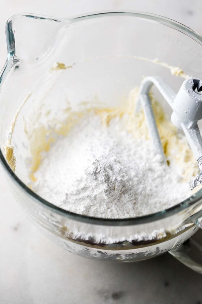 add powdered sugar and mix until smooth