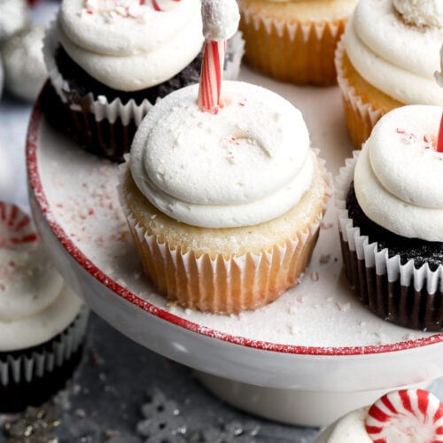 white chocolate peppermint cupcakes on a small cake platter