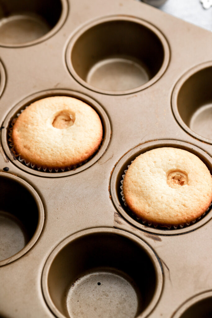 white cupcakes with truffle baked inside