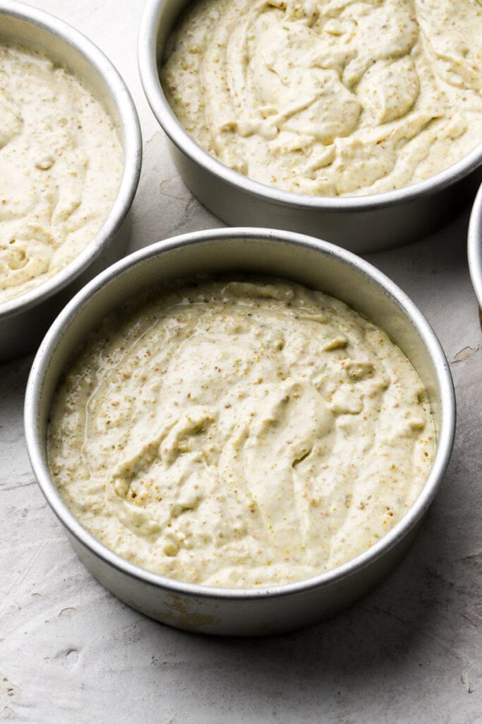 cake batter in prepared pans