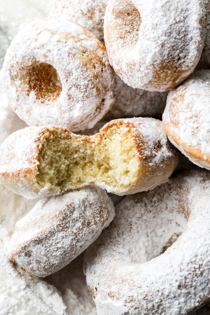 close up of powdered sugar donuts