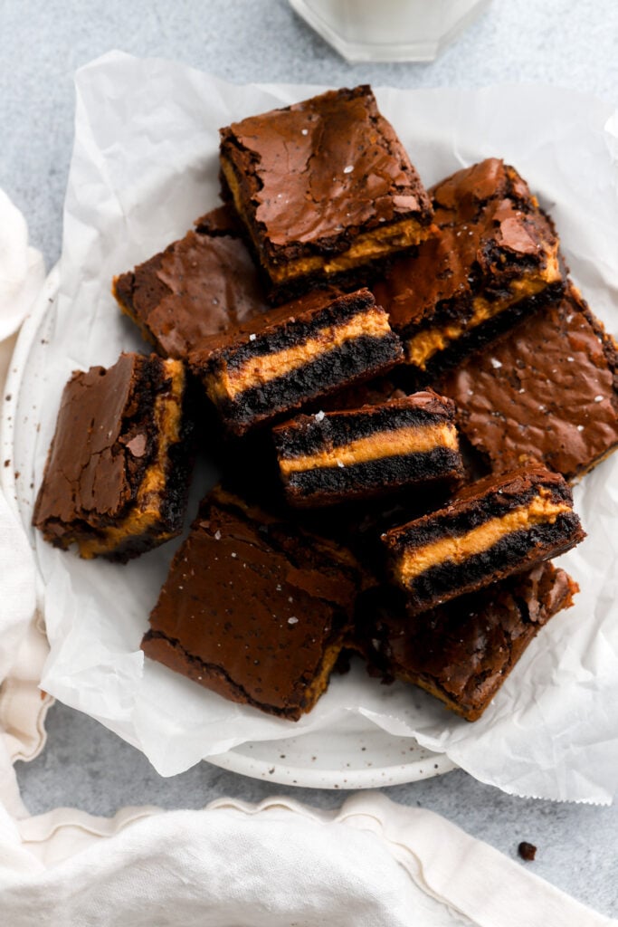 pumpkin brownies with a pumpkin cream center on a plate
