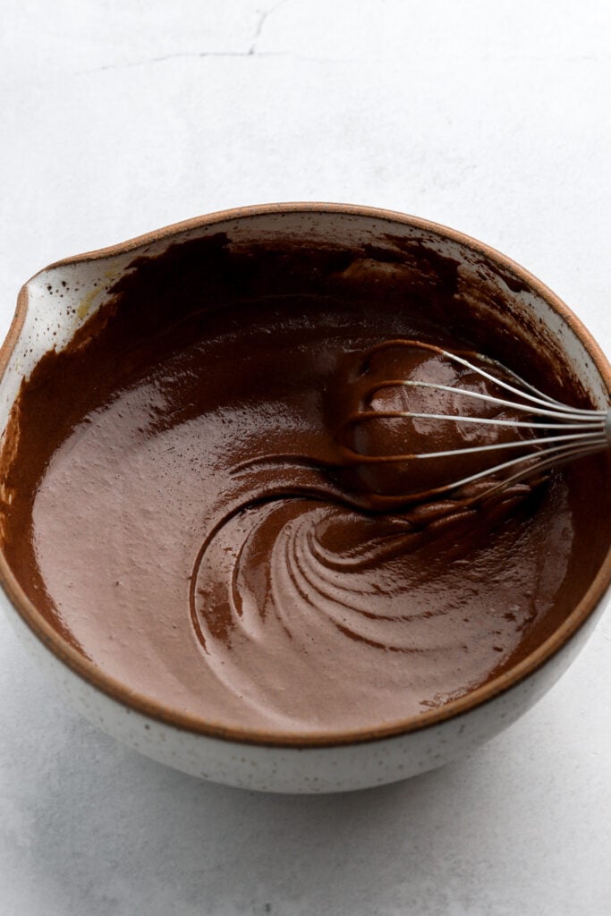 melted chocolate and butter added to eggs and sugar