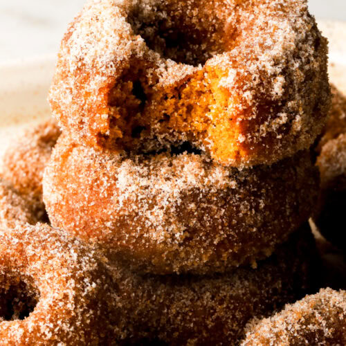 pumpkin donuts covered in cinnamon sugar