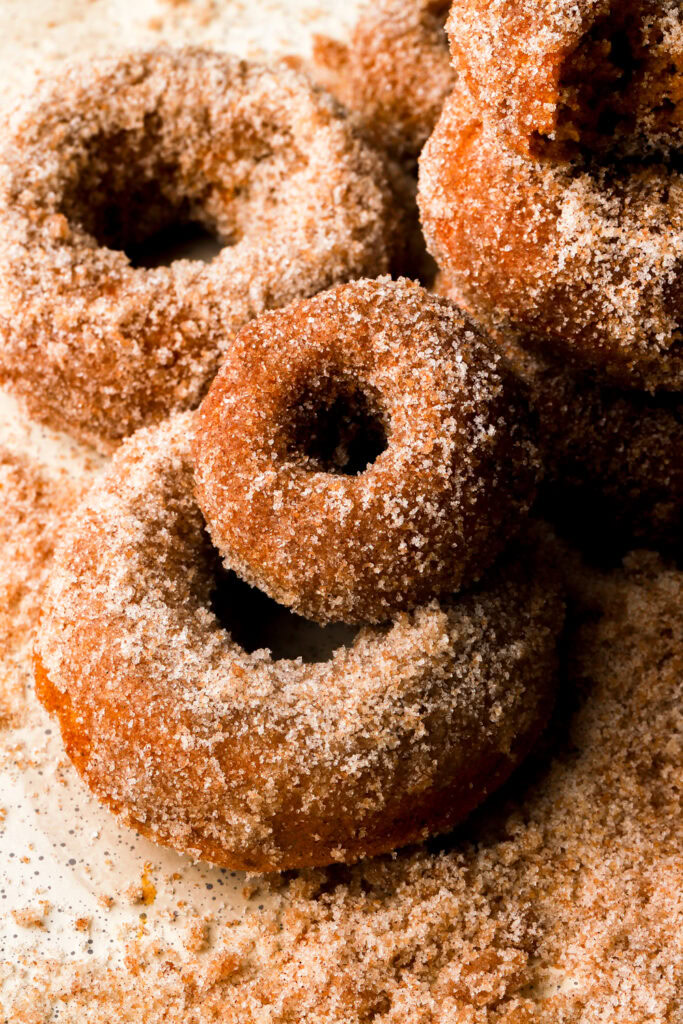 pumpkin donuts covered in cinnamon sugar