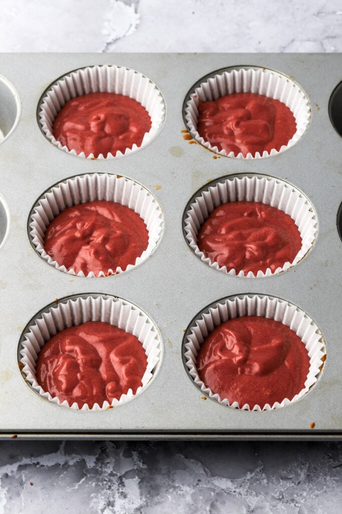 unbaked cupcake batter in pans