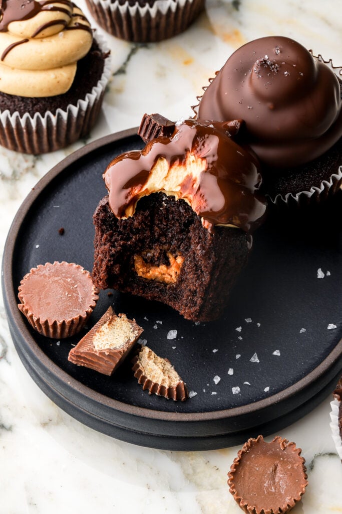 bite taken out of chocolate peanut butter cupcakes