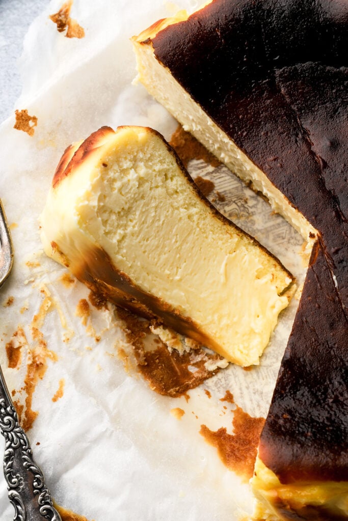slice of cheesecake on its side, showing the texture of the filling