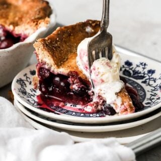 Strawberry blueberry pie with vanilla ice cream on top