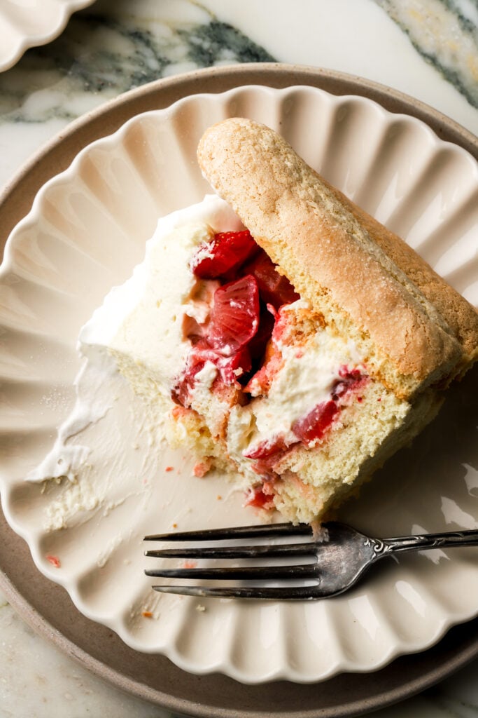slice of strawberry charlotte cake on a plate