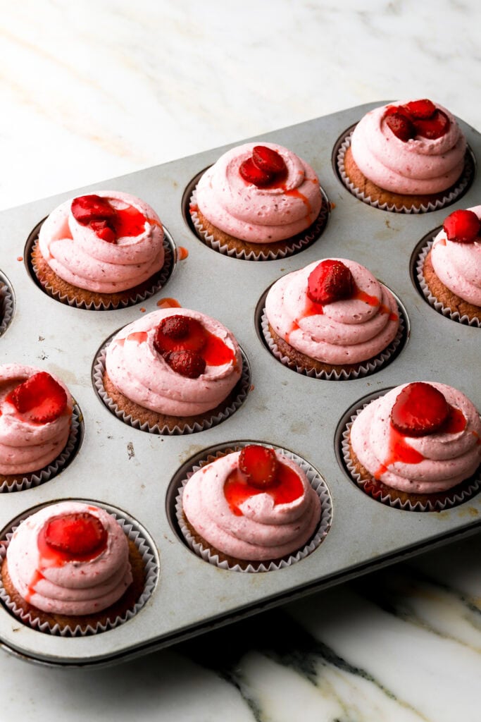 cupcakes topped with strawberry topping