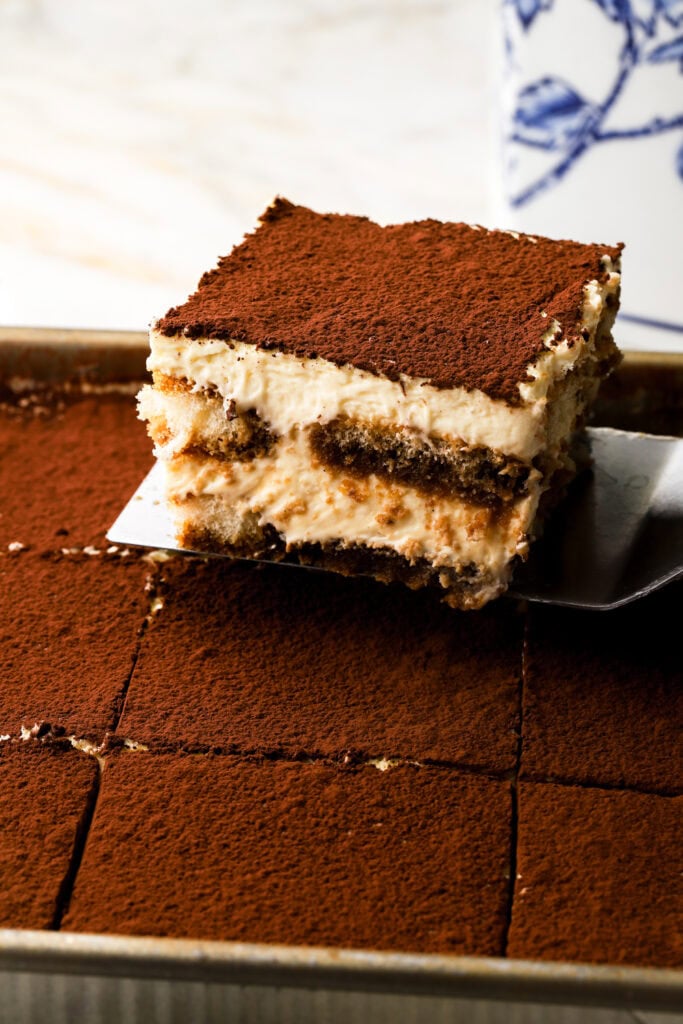 slice of tiramisu being taken out of the pan