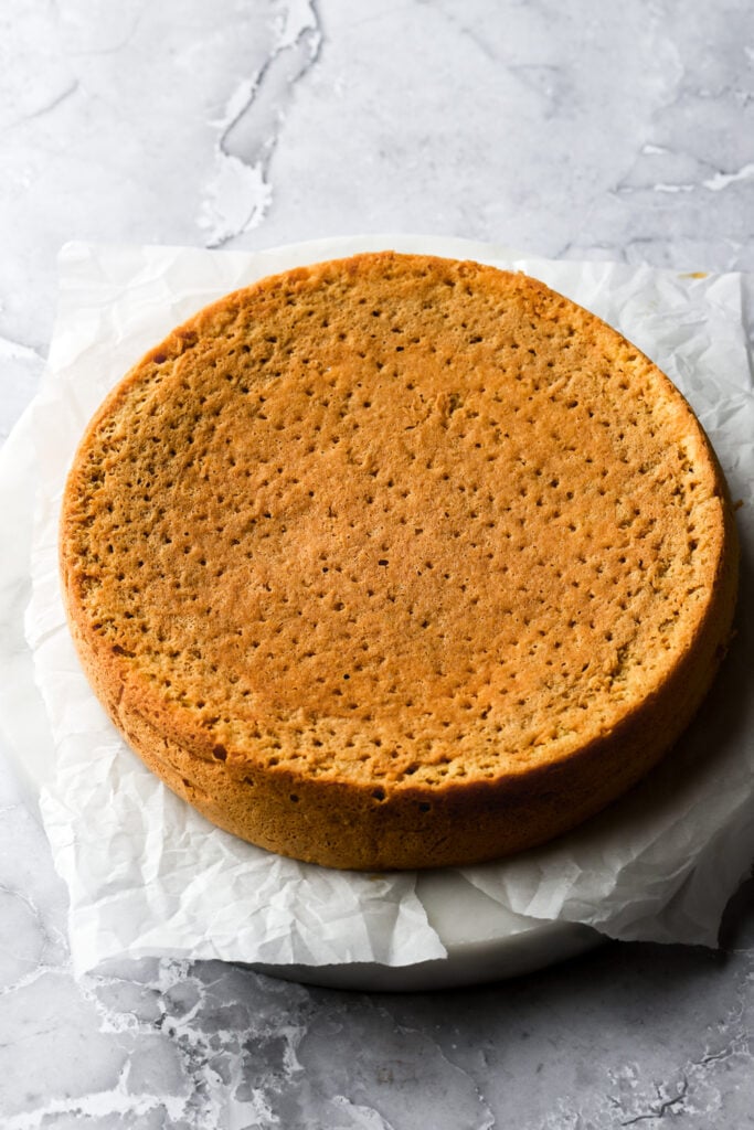 fork holes poked into the cake and soaked with coffee