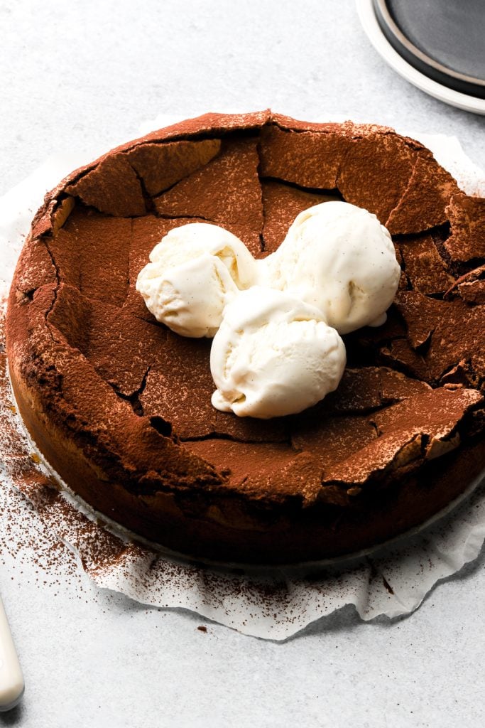 torte tenerina dusted with cocoa powder and topped with ice cream
