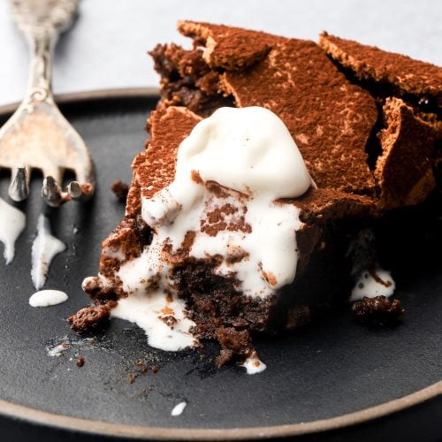 torta tenerina slice on a plate with ice cream
