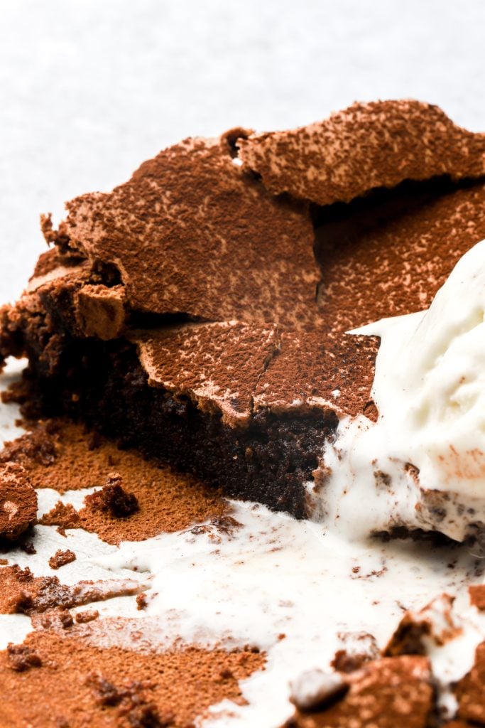 flourless chocolate cake topped with ice cream