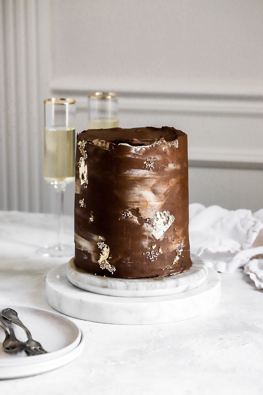 cake frosted with dark chocolate ganache