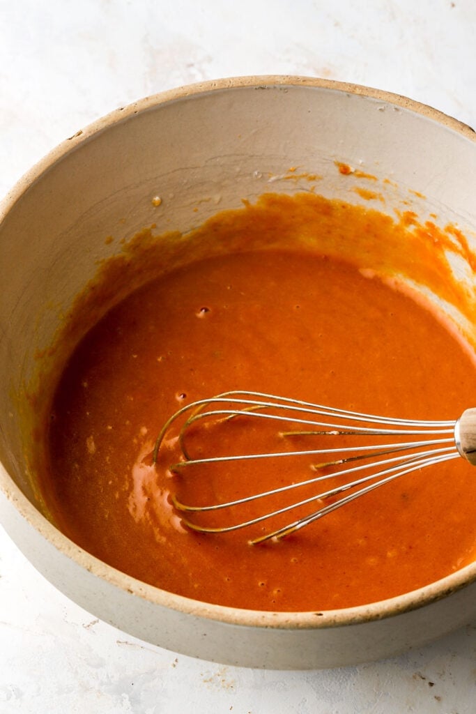 whisk together the oil, sugars, eggs, pumpkin and yogurt