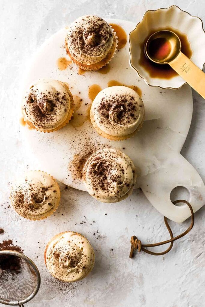 vanilla latte cupcakes with cocoa powder dusting