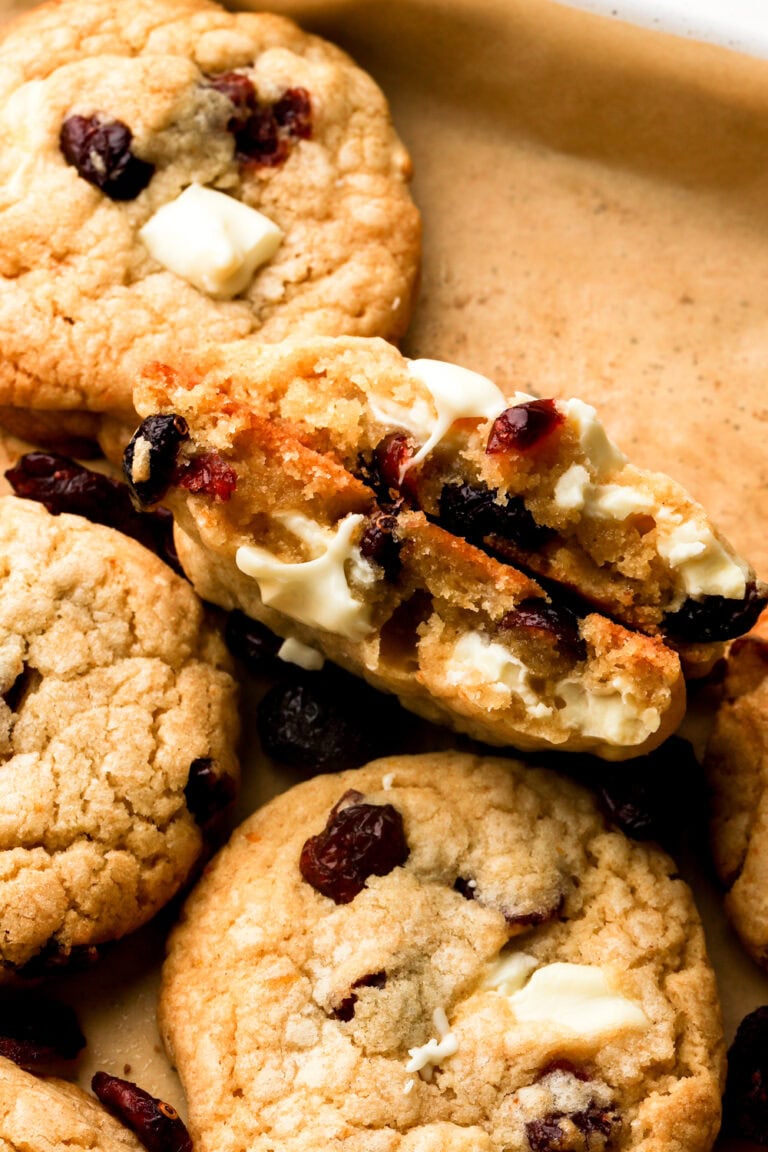white chocolate cranberry cookies broken in half to show the inside