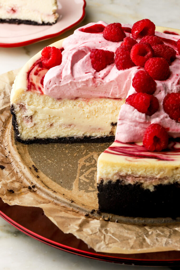 close up of the inside of a white chocolate raspberry cheesecake