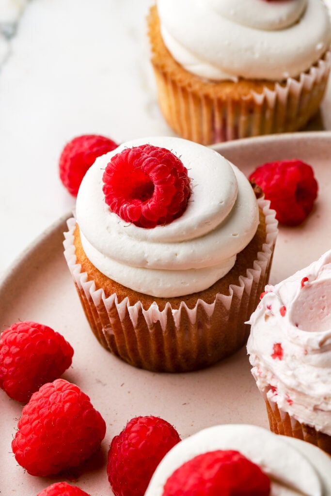 white chocolate raspberry cupcakes frosted with white chocolate buttercream